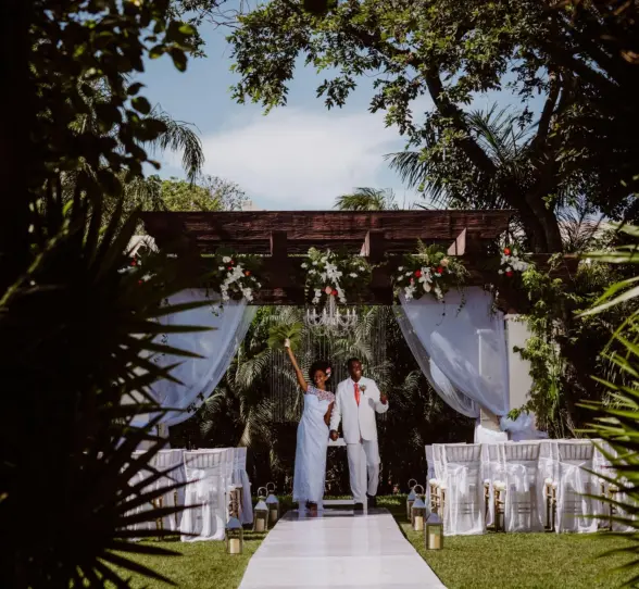bride and groom at the garden venue at Sandos Playacar