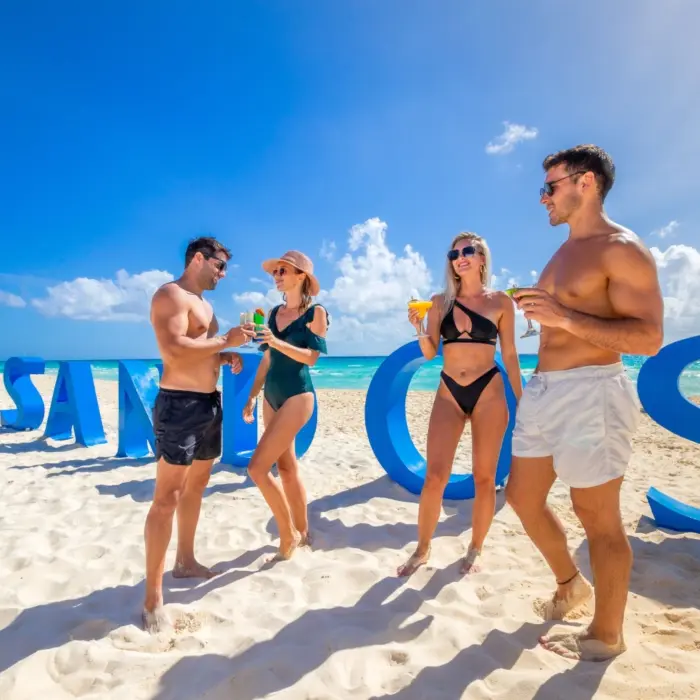 couples and friends on the beach at Sandos Playacar