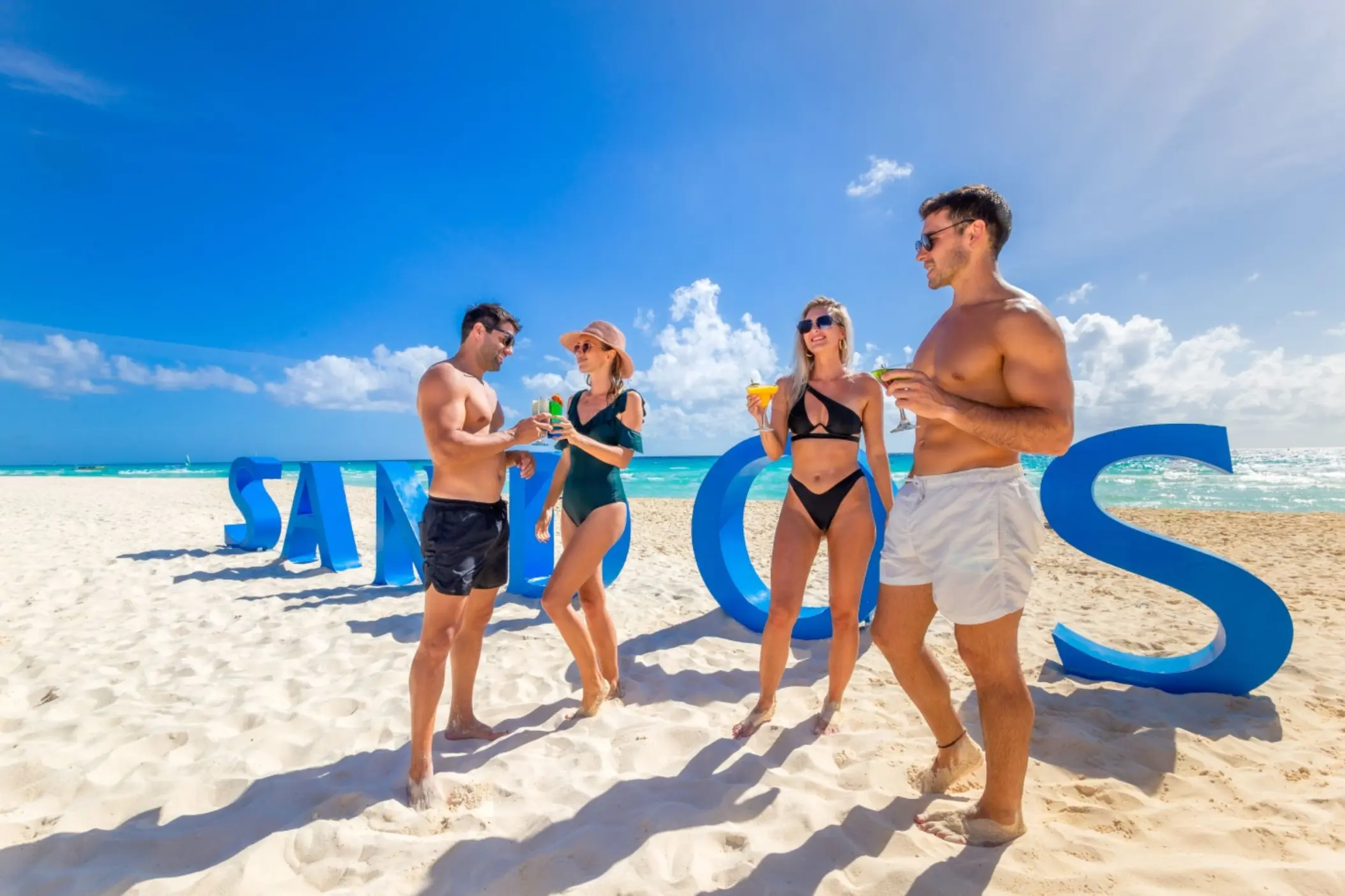 couples and friends on the beach at Sandos Playacar