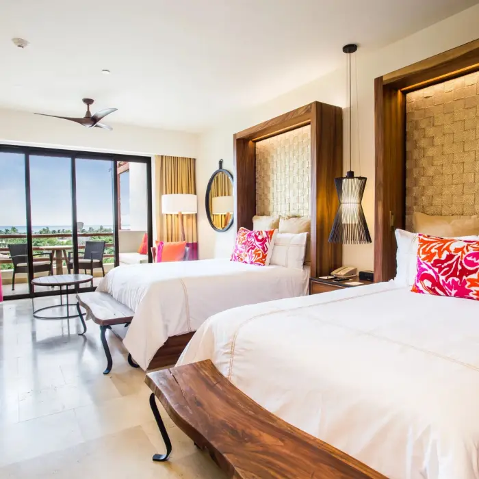 junior suite ocean view with double beds at Secrets Akumal Riviera Maya