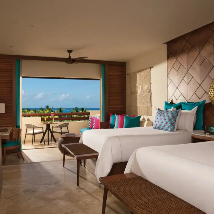 junior suite partial ocean view with two beds at Secrets Maroma Beach Riviera Cancun