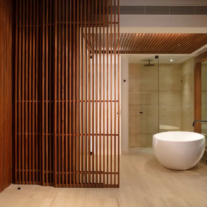 Luxurious spa-style bathroom featuring a freestanding soaking tub.