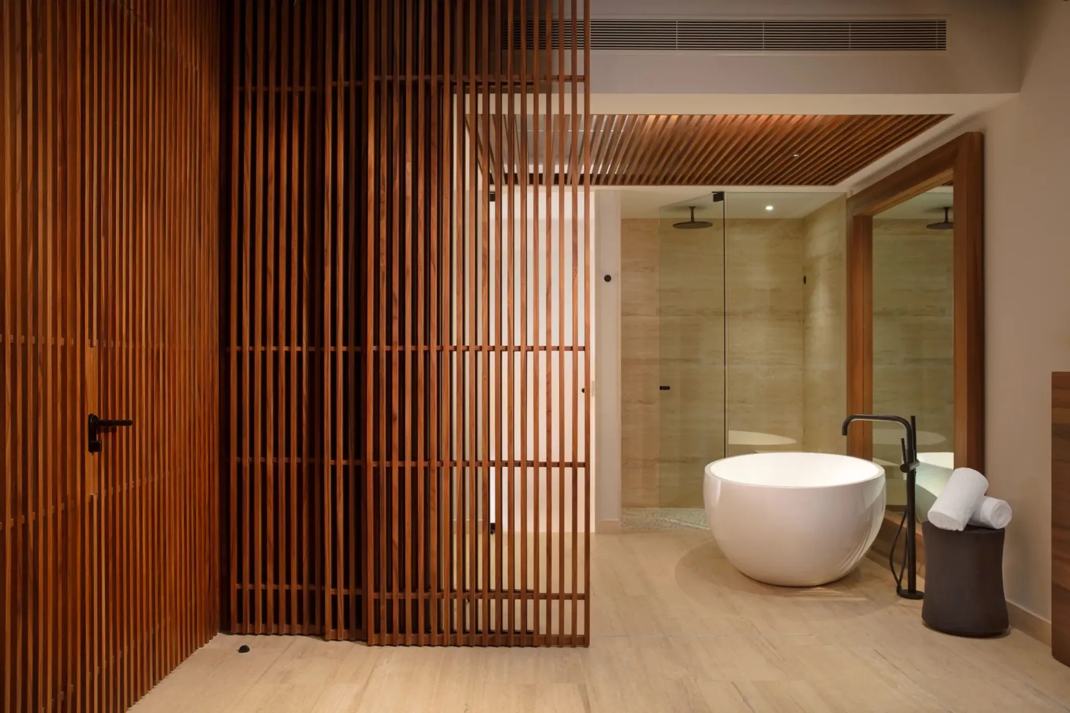 Luxurious spa-style bathroom featuring a freestanding soaking tub.