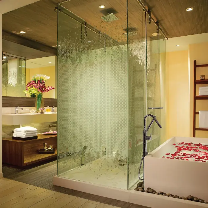 bathroom of the master suite with tub at Secrets The Vine Cancun