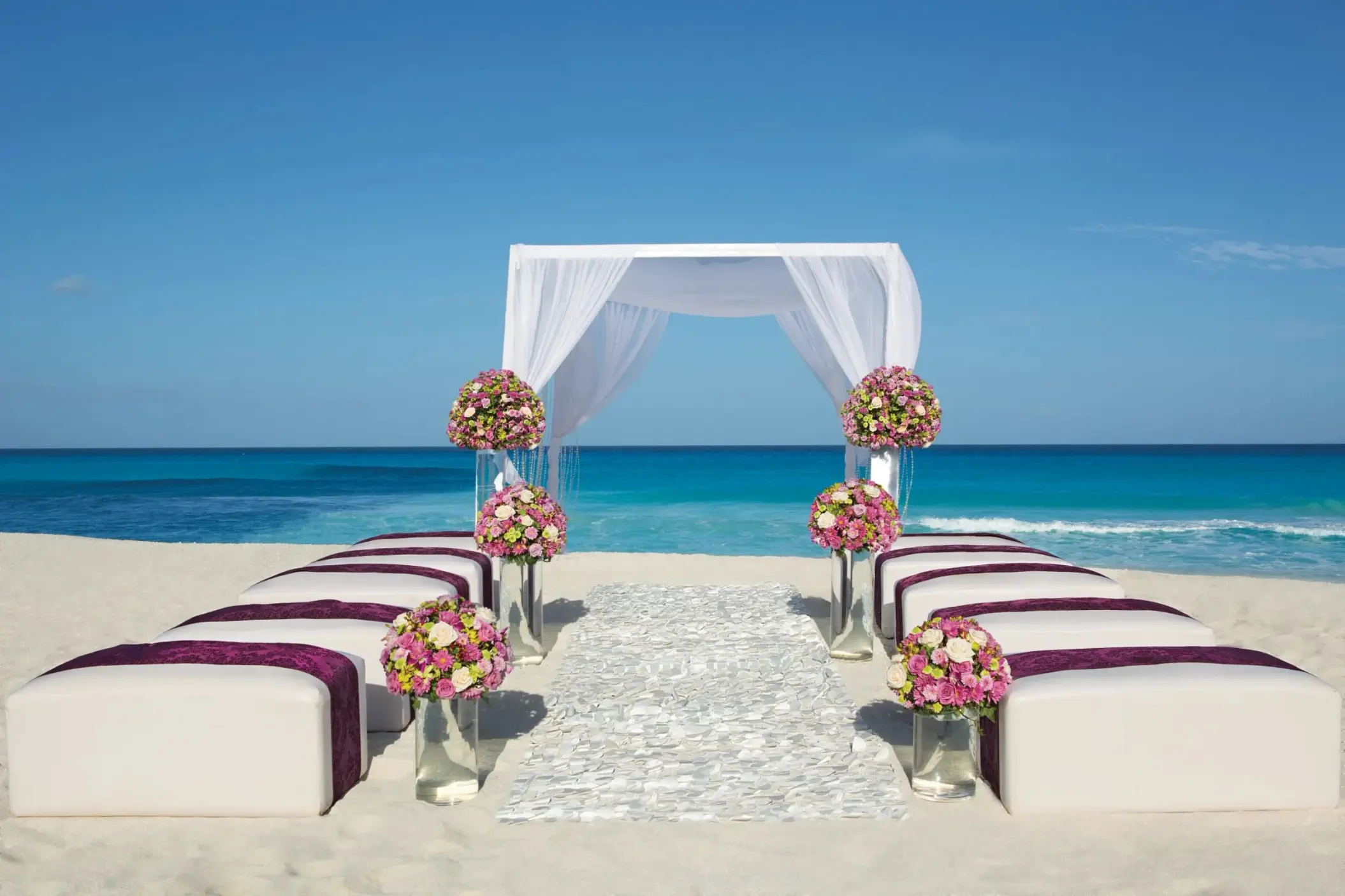beach wedding ceremony setup at Secrets The Vine Cancun