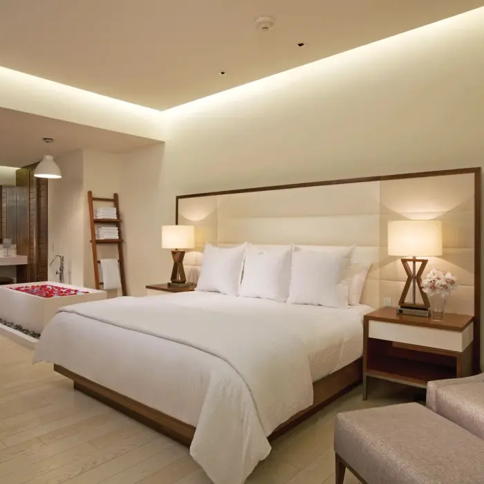 bedroom of preferred club governor suite at Secrets The Vine Cancun
