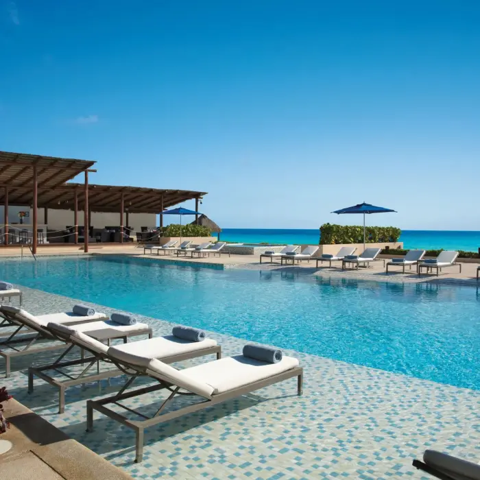 pool with loungers at Secrets The Vine Cancun