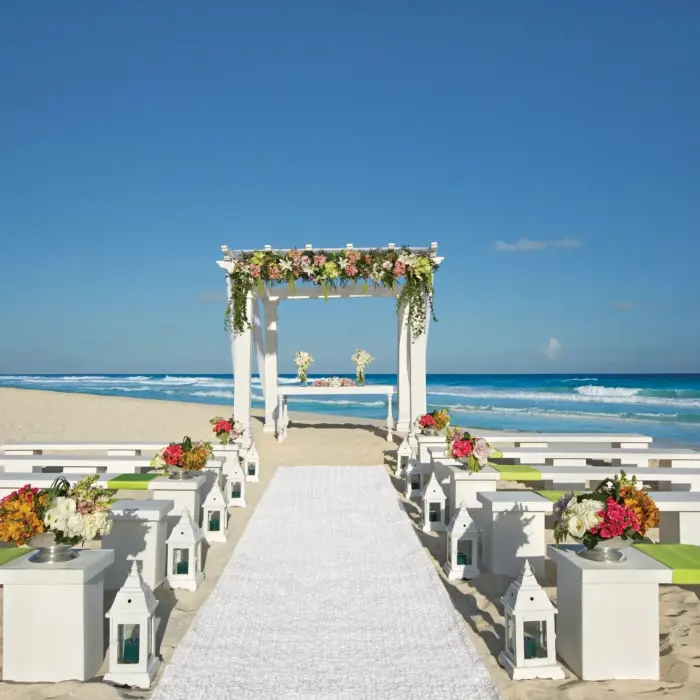 wedding ceremony setup on the beach at Secrets The Vine Cancun