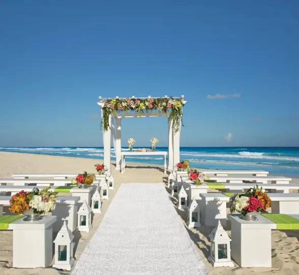wedding ceremony setup on the beach at Secrets The Vine Cancun