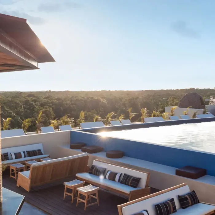 Rooftop bar with ocean views, stylish seating, and a chic setup ideal for sunset cocktails.