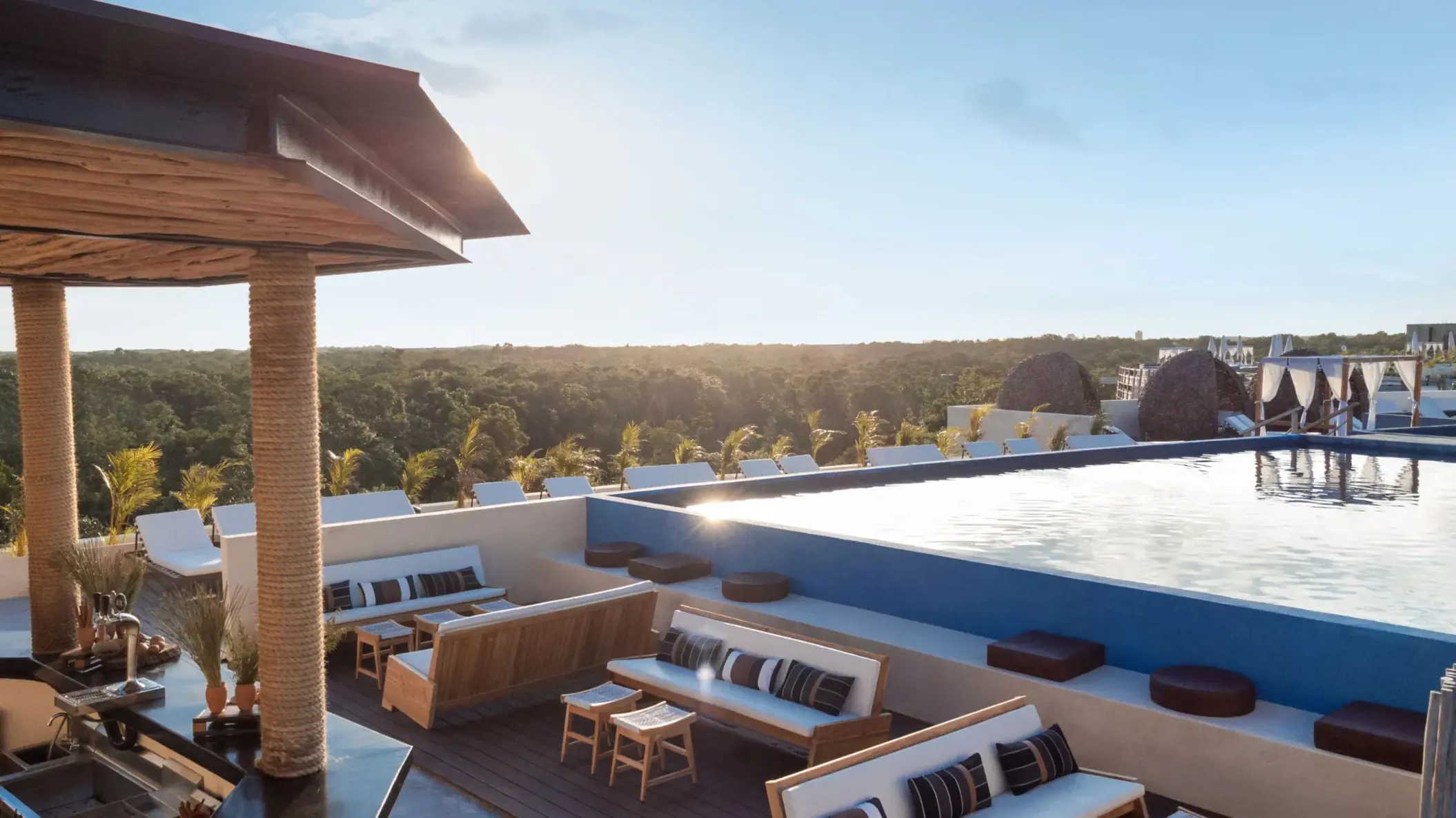 Rooftop bar with ocean views, stylish seating, and a chic setup ideal for sunset cocktails.