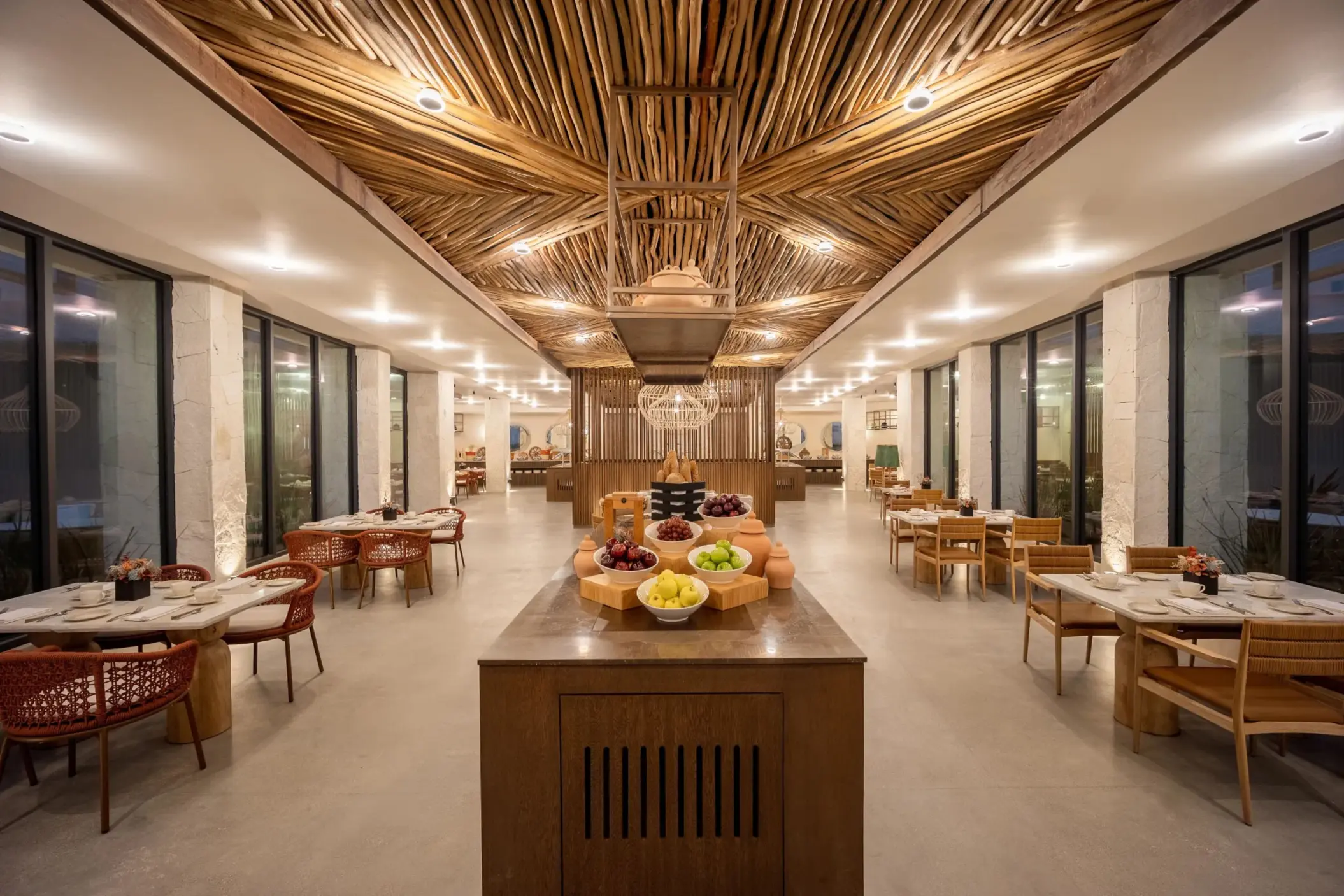 Colorful Market Café buffet with vibrant lighting, marble counters, and fresh international dishes.