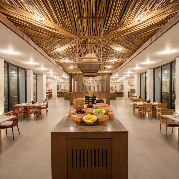 Colorful Market Café buffet with vibrant lighting, marble counters, and fresh international dishes.