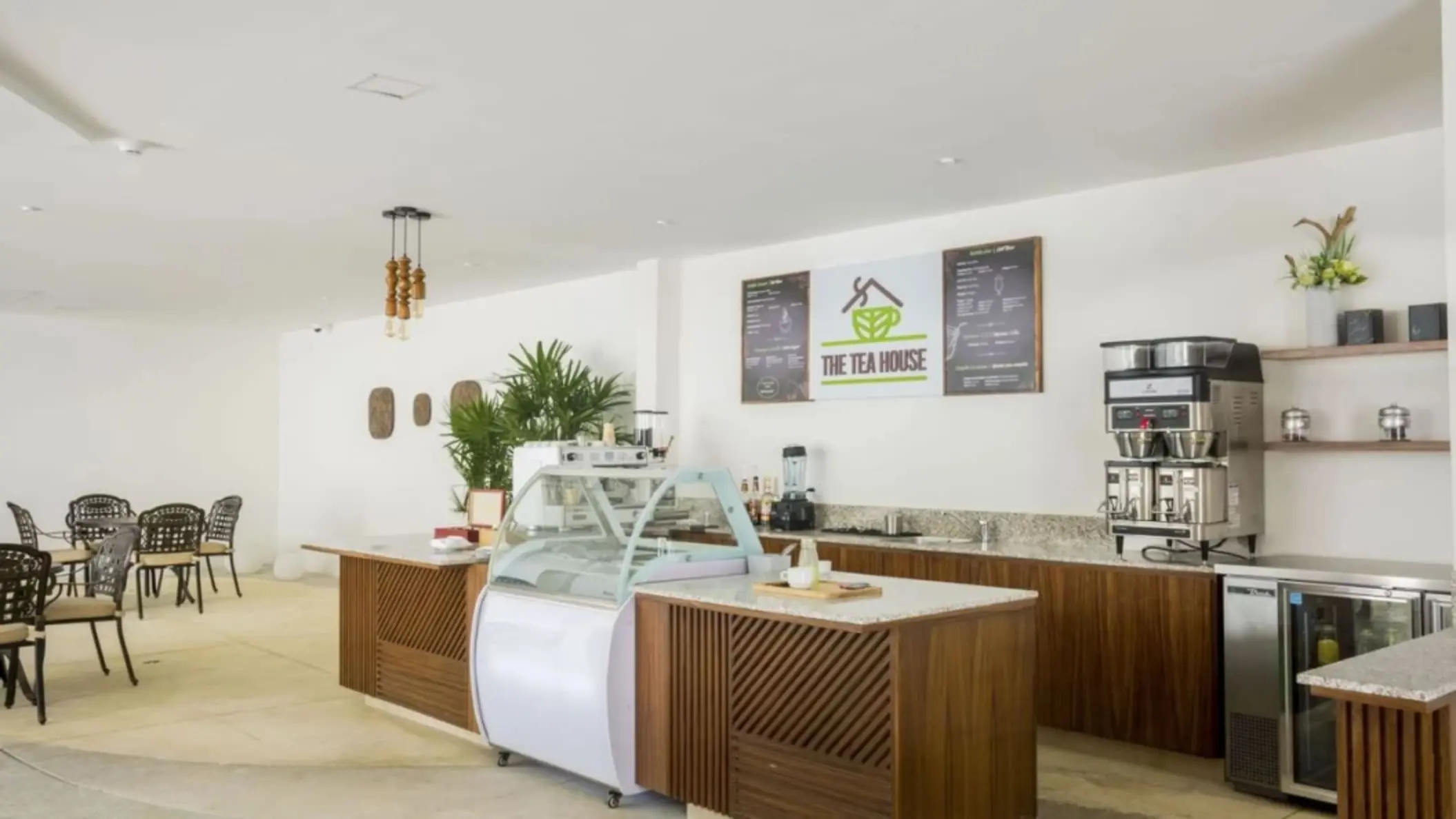 The Tea House café serving coffee, tea, and ice cream with indoor seating area.