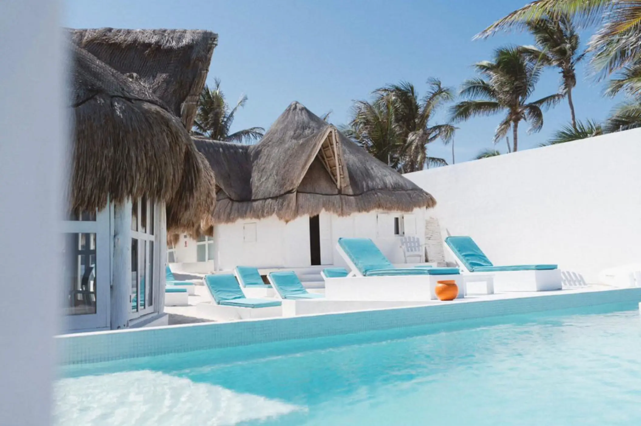 pool and loungers at  Shambala Petit Beach House