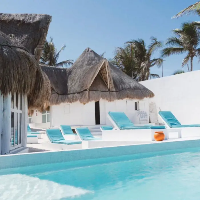 pool and loungers at  Shambala Petit Beach House