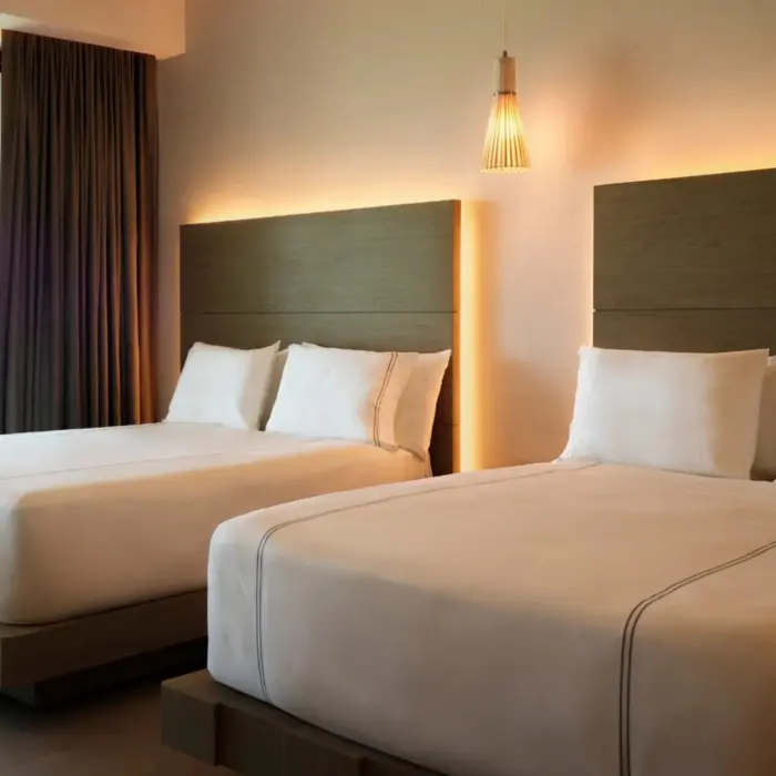 suite with two queen beds at SLS Playa Mujeres