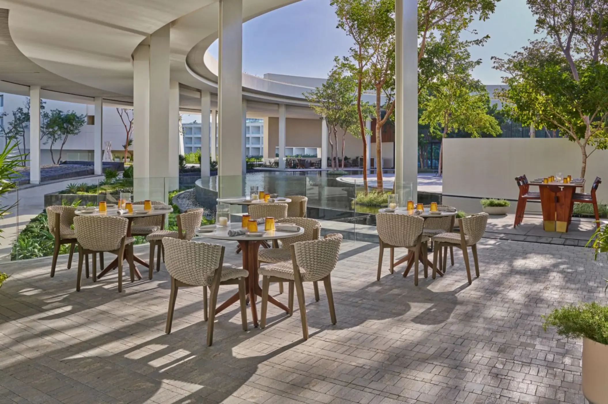 chaya restaurant outdoor seating with waterfall view at St. Regis Kanai Resort Riviera Maya