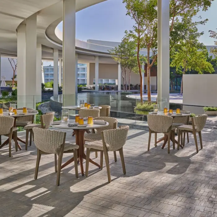 chaya restaurant outdoor seating with waterfall view at St. Regis Kanai Resort Riviera Maya