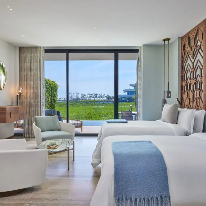 grand luxe guest room with two queen beds ocean view at St. Regis Kanai Resort Riviera Maya