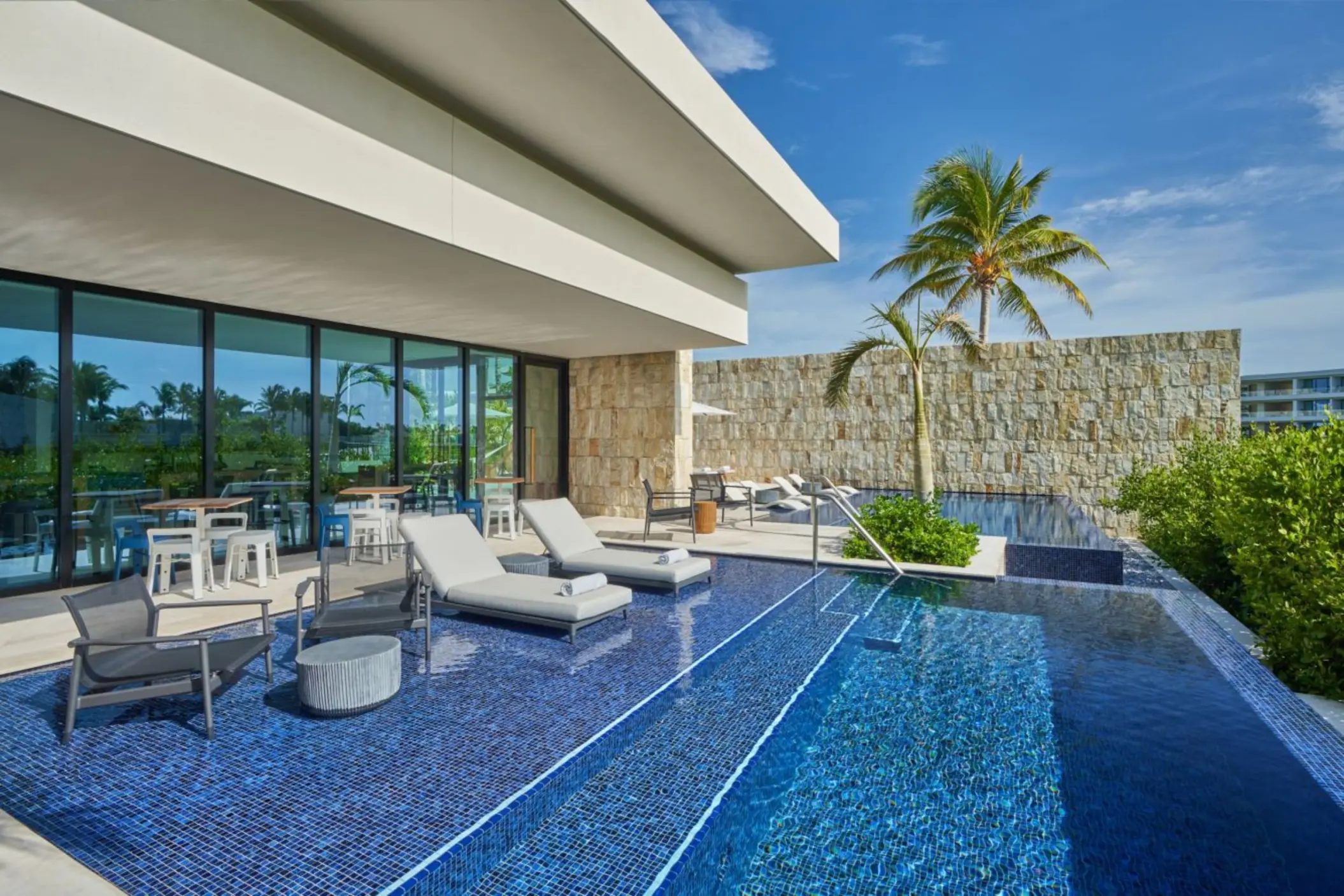 pool with loungers at St. Regis Kanai Resort Riviera Maya