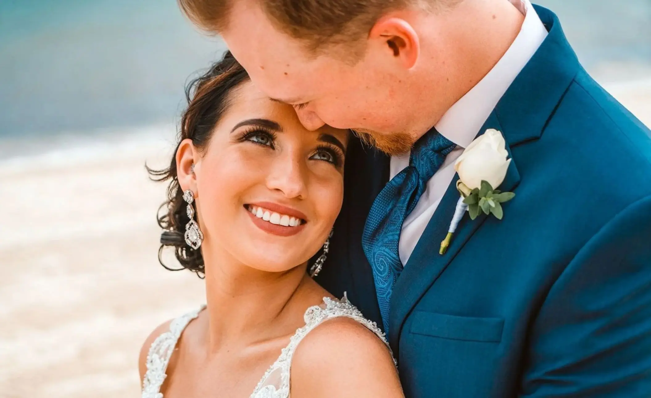 bride and groom on the beach at Sun Palace Cancun