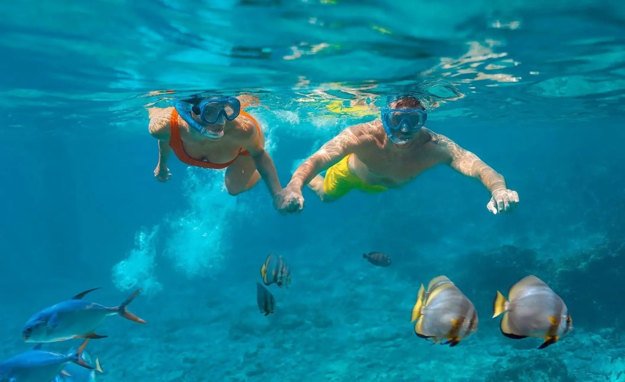 couple snorkeling at Sun Palace Cancun