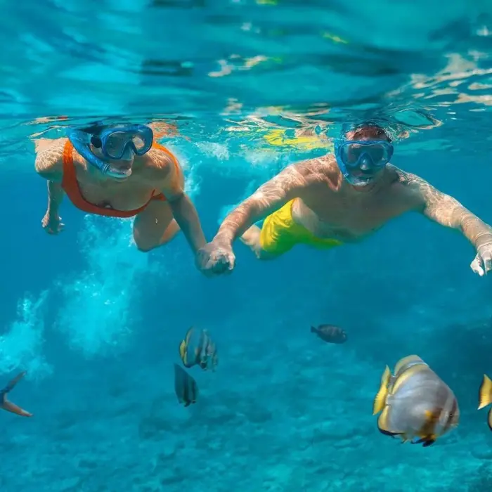 couple snorkeling at Sun Palace Cancun