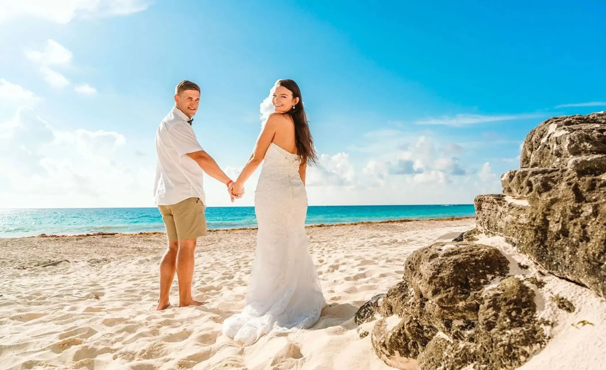 bride and groom on the beach at Sun Palace Cancun