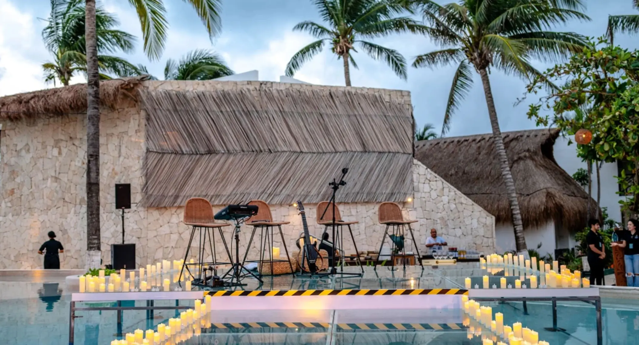 live music on a stage over the pool at The Beachfront by The Fives