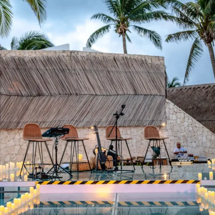 live music on a stage over the pool at The Beachfront by The Fives