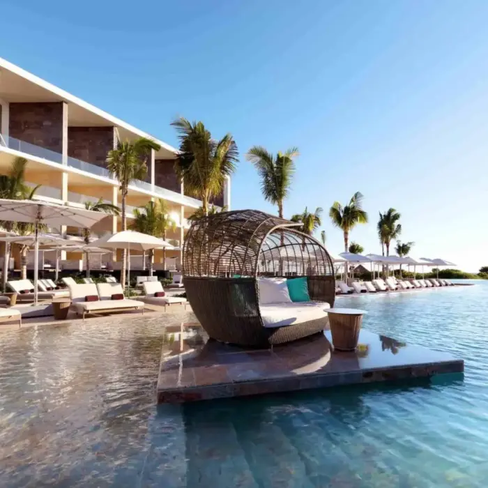 main pool with loungers and cabanas at trs coral hotel