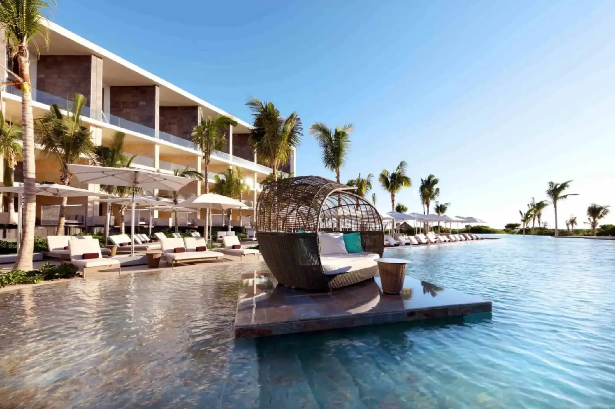 main pool with loungers and cabanas at trs coral hotel