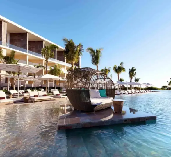 main pool with loungers and cabanas at trs coral hotel