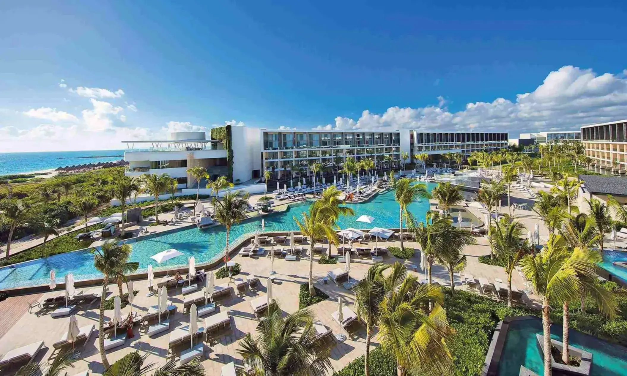 aerial view of trs coral hotel with its buildings and pools