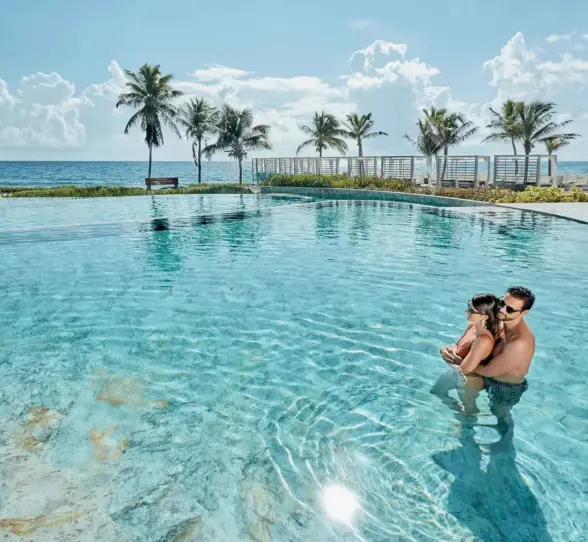 couple in the oceanfront pool at TRS Yucatan Hotel