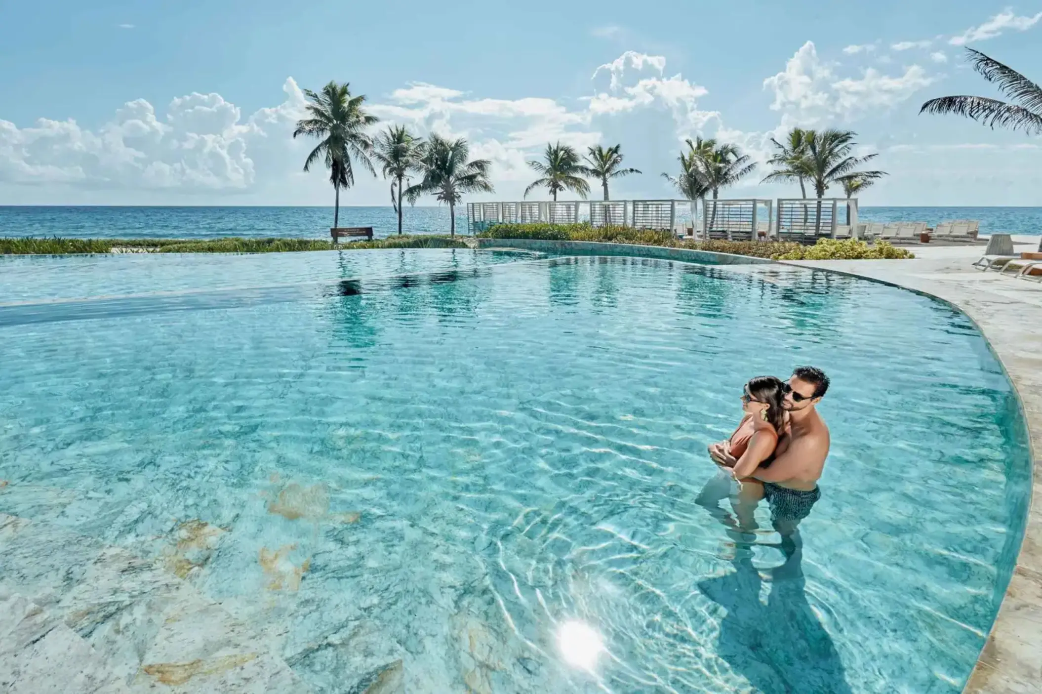 couple in the oceanfront pool at TRS Yucatan Hotel