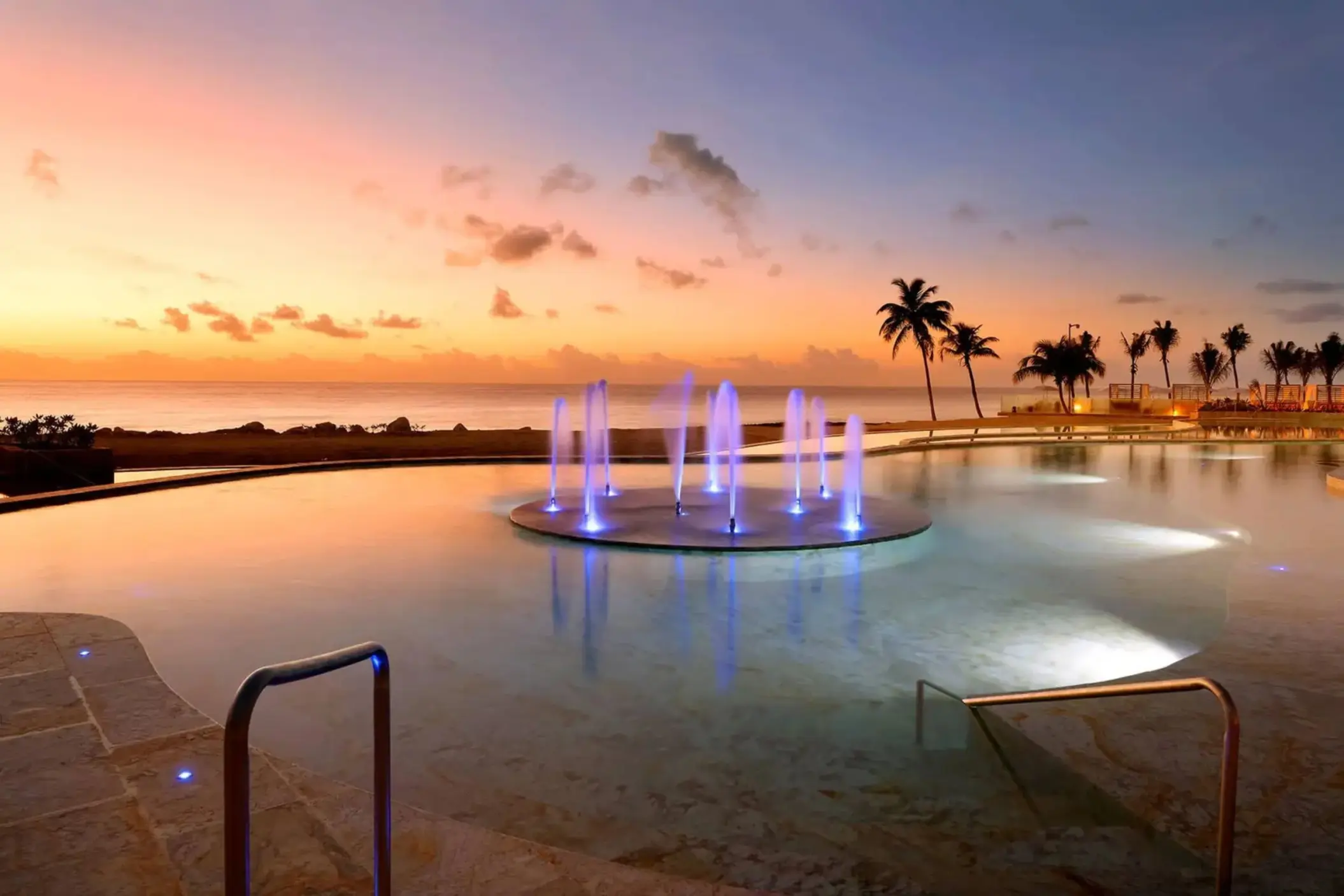 pool with fountain in the evening at TRS Yucatan Hotel