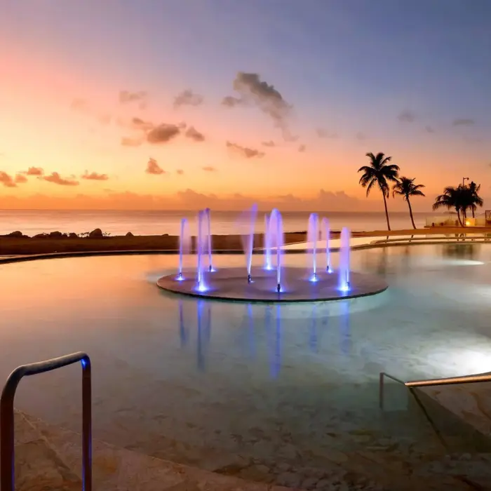 pool with fountain in the evening at TRS Yucatan Hotel