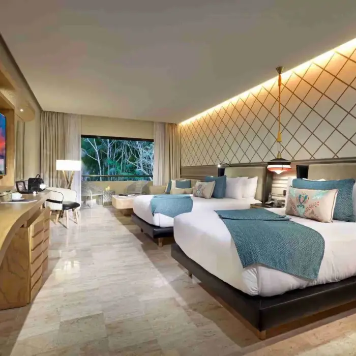 suite with two beds at TRS Yucatan Hotel