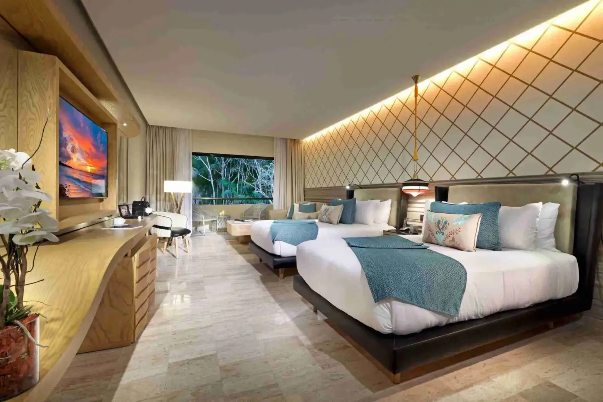 suite with two beds at TRS Yucatan Hotel