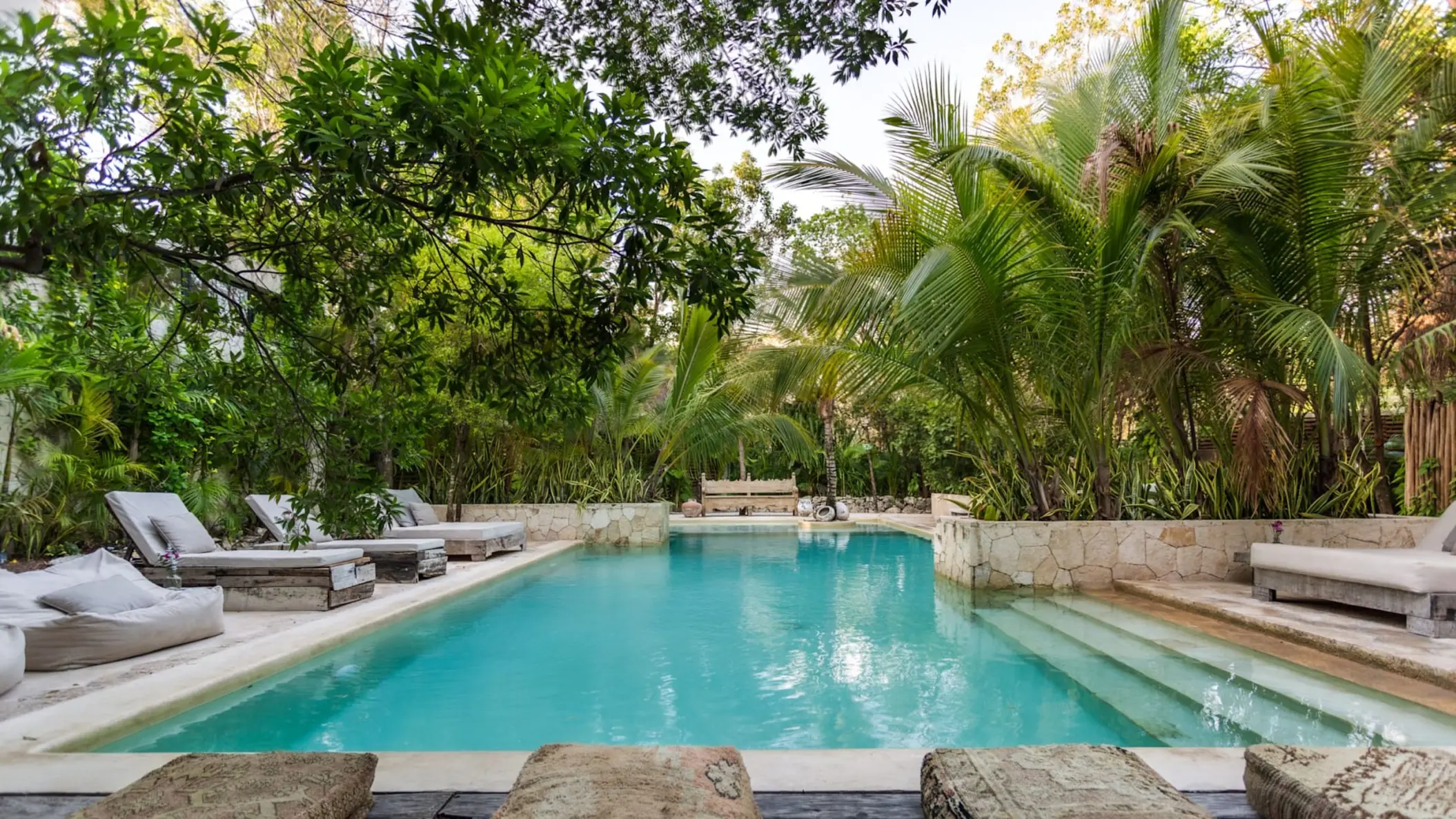 pool with loungers at Una Vida Tulum