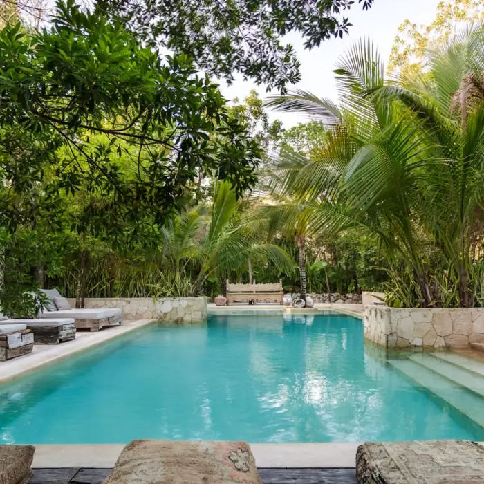 pool with loungers at Una Vida Tulum