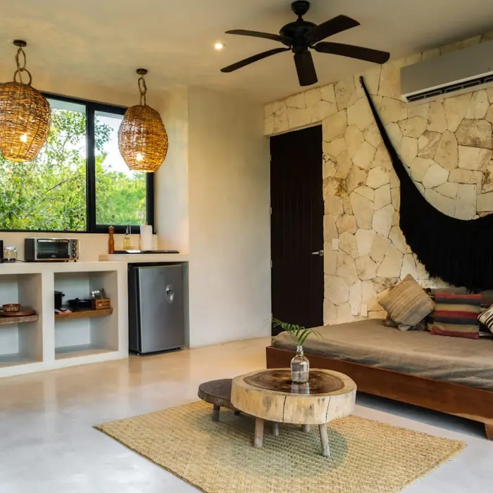 suite with king bed and kithennete at Una Vida Tulum