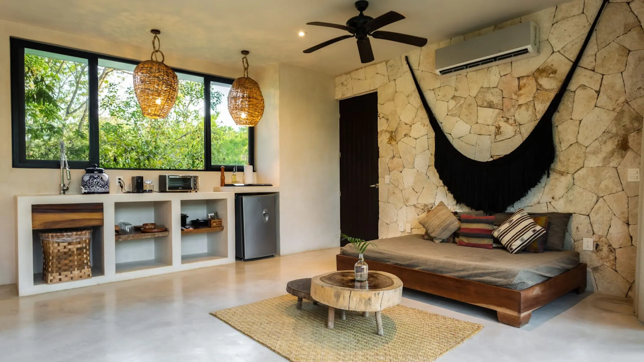 suite with king bed and kithennete at Una Vida Tulum