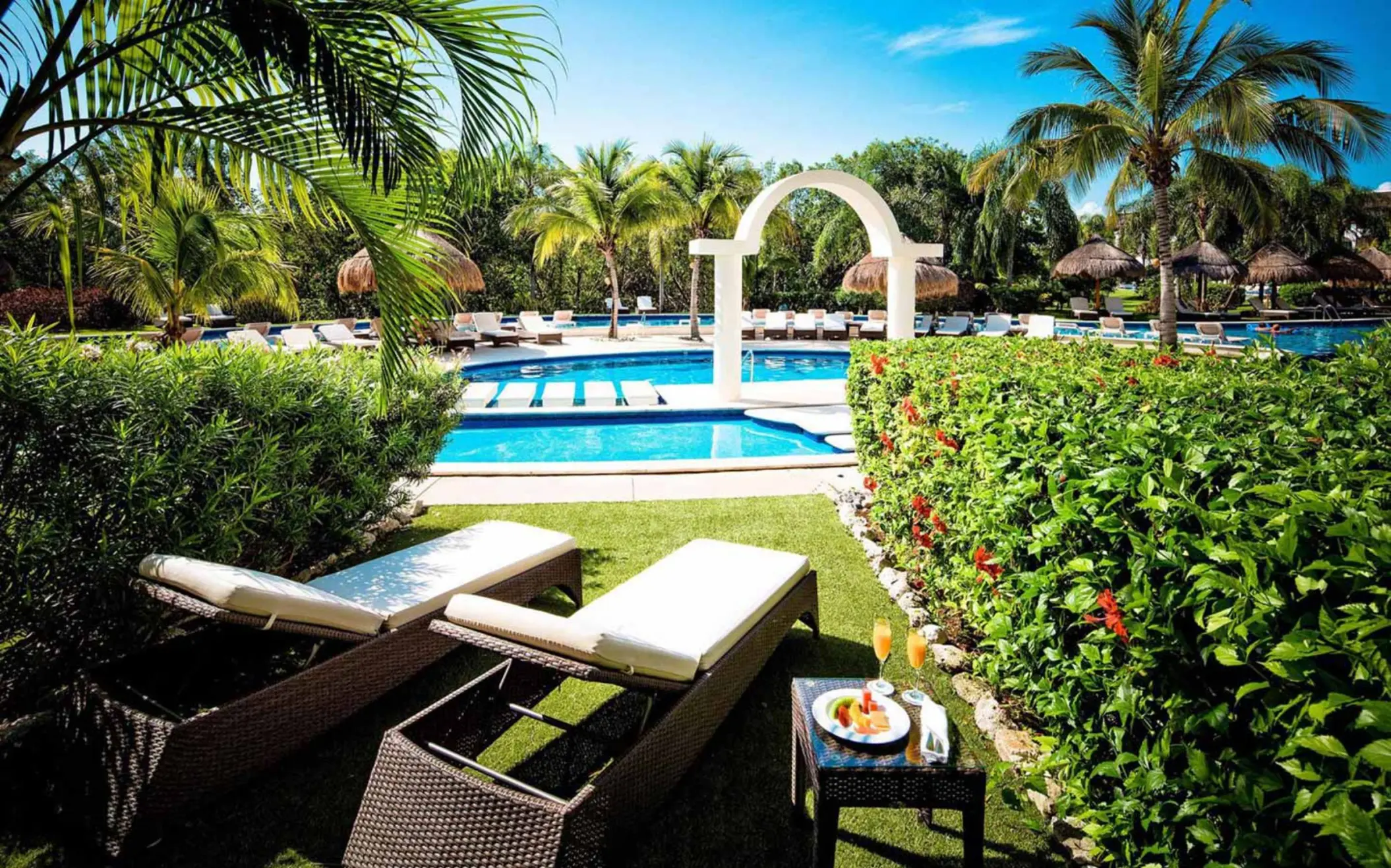 loungers by the pool at golden junior suite swim up at Valentin Imperial Riviera Maya