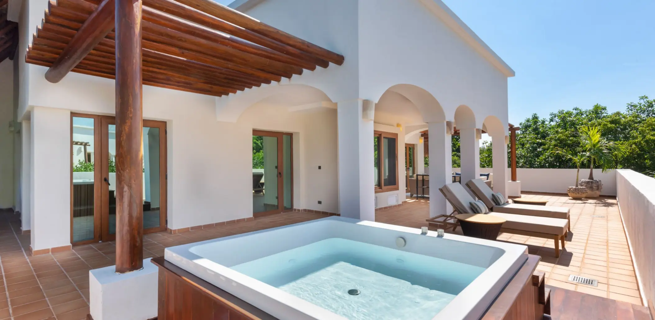 terrace of onyx suite king size with jacuzzi and loungers