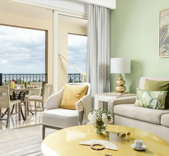 living space and balcony of suite at villa del palmar cancun