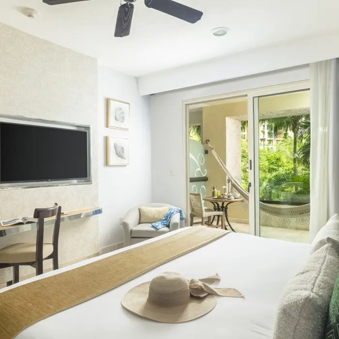 suite with king size bed at villa del palmar cancun