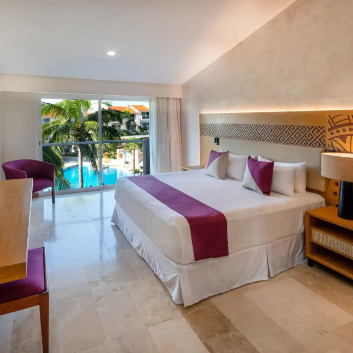 room with king bed and pool view at Viva Azteca by Wyndham